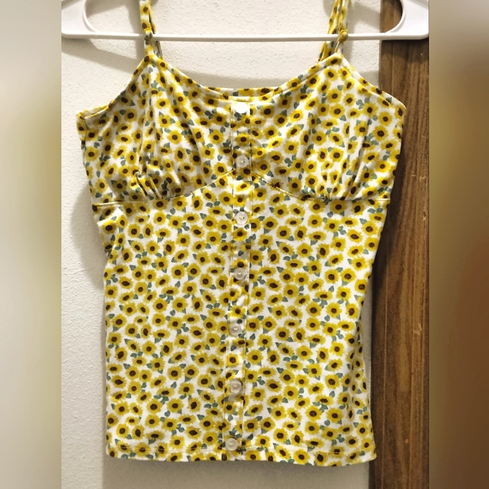 A small (3-5), No Boundaries yellow floral shirt/blouse.
